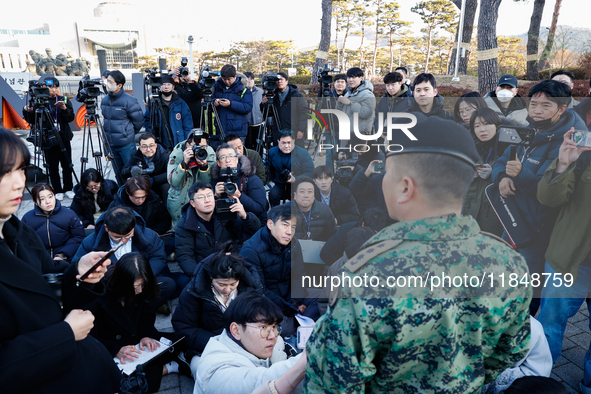 Colonel Kim Hyun-tae, Commander of the 707th Special Mission Group, holds a press conference in front of the Defense Convention Center in Yo...