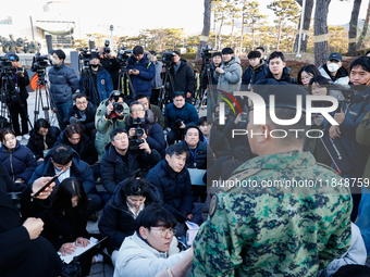 Colonel Kim Hyun-tae, Commander of the 707th Special Mission Group, holds a press conference in front of the Defense Convention Center in Yo...