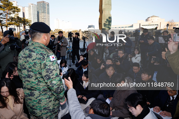 Colonel Kim Hyun-tae, Commander of the 707th Special Mission Group, holds a press conference in front of the Defense Convention Center in Yo...