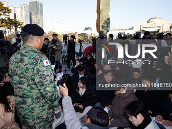 Colonel Kim Hyun-tae, Commander of the 707th Special Mission Group, holds a press conference in front of the Defense Convention Center in Yo...