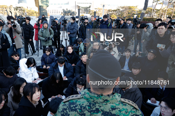 Colonel Kim Hyun-tae, Commander of the 707th Special Mission Group, holds a press conference in front of the Defense Convention Center in Yo...