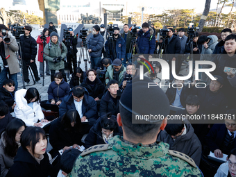 Colonel Kim Hyun-tae, Commander of the 707th Special Mission Group, holds a press conference in front of the Defense Convention Center in Yo...