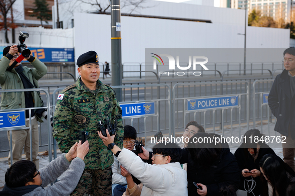 Colonel Kim Hyun-tae, Commander of the 707th Special Mission Group, holds a press conference in front of the Defense Convention Center in Yo...