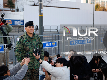 Colonel Kim Hyun-tae, Commander of the 707th Special Mission Group, holds a press conference in front of the Defense Convention Center in Yo...