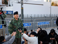 Colonel Kim Hyun-tae, Commander of the 707th Special Mission Group, holds a press conference in front of the Defense Convention Center in Yo...