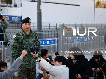 Colonel Kim Hyun-tae, Commander of the 707th Special Mission Group, holds a press conference in front of the Defense Convention Center in Yo...