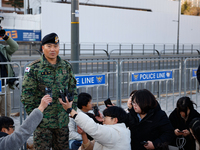 Colonel Kim Hyun-tae, Commander of the 707th Special Mission Group, holds a press conference in front of the Defense Convention Center in Yo...