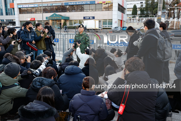 Colonel Kim Hyun-tae, Commander of the 707th Special Mission Group, holds a press conference in front of the Defense Convention Center in Yo...