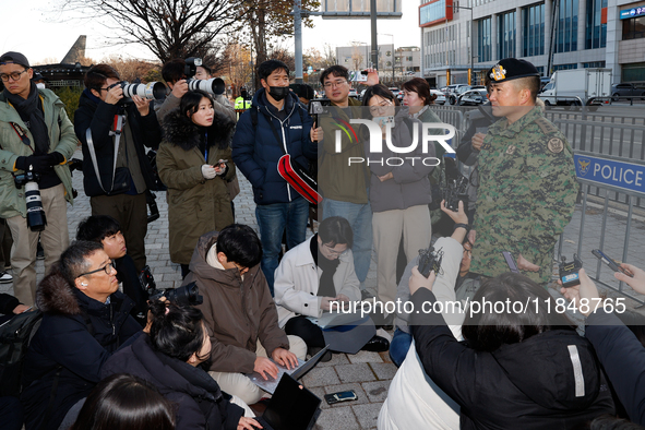 Colonel Kim Hyun-tae, Commander of the 707th Special Mission Group, holds a press conference in front of the Defense Convention Center in Yo...