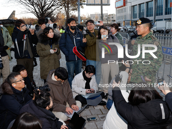 Colonel Kim Hyun-tae, Commander of the 707th Special Mission Group, holds a press conference in front of the Defense Convention Center in Yo...