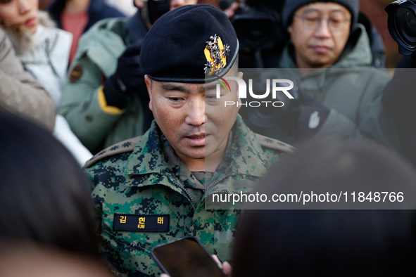 Colonel Kim Hyun-tae, Commander of the 707th Special Mission Group, holds a press conference in front of the Defense Convention Center in Yo...