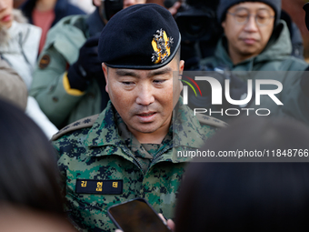 Colonel Kim Hyun-tae, Commander of the 707th Special Mission Group, holds a press conference in front of the Defense Convention Center in Yo...