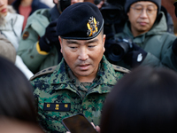 Colonel Kim Hyun-tae, Commander of the 707th Special Mission Group, holds a press conference in front of the Defense Convention Center in Yo...