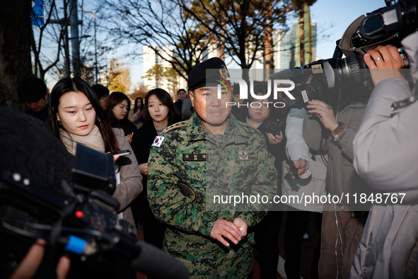 Colonel Kim Hyun-tae, Commander of the 707th Special Mission Group, holds a press conference in front of the Defense Convention Center in Yo...