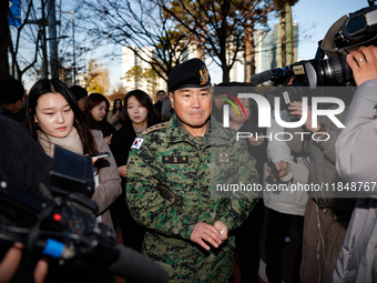 Colonel Kim Hyun-tae, Commander of the 707th Special Mission Group, holds a press conference in front of the Defense Convention Center in Yo...