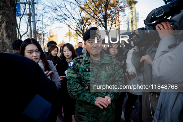 Colonel Kim Hyun-tae, Commander of the 707th Special Mission Group, holds a press conference in front of the Defense Convention Center in Yo...