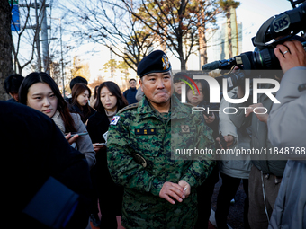 Colonel Kim Hyun-tae, Commander of the 707th Special Mission Group, holds a press conference in front of the Defense Convention Center in Yo...