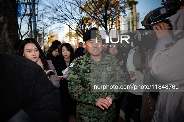 Colonel Kim Hyun-tae, Commander of the 707th Special Mission Group, holds a press conference in front of the Defense Convention Center in Yo...