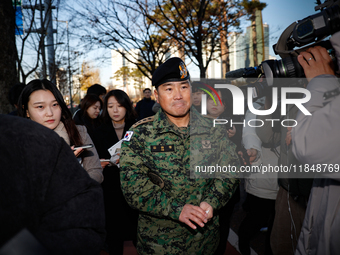 Colonel Kim Hyun-tae, Commander of the 707th Special Mission Group, holds a press conference in front of the Defense Convention Center in Yo...