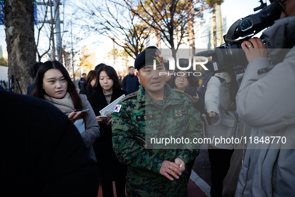 Colonel Kim Hyun-tae, Commander of the 707th Special Mission Group, holds a press conference in front of the Defense Convention Center in Yo...