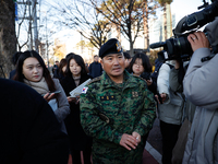 Colonel Kim Hyun-tae, Commander of the 707th Special Mission Group, holds a press conference in front of the Defense Convention Center in Yo...