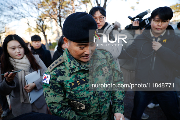 Colonel Kim Hyun-tae, Commander of the 707th Special Mission Group, holds a press conference in front of the Defense Convention Center in Yo...