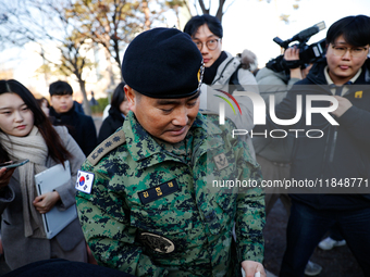 Colonel Kim Hyun-tae, Commander of the 707th Special Mission Group, holds a press conference in front of the Defense Convention Center in Yo...