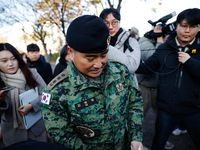 Colonel Kim Hyun-tae, Commander of the 707th Special Mission Group, holds a press conference in front of the Defense Convention Center in Yo...