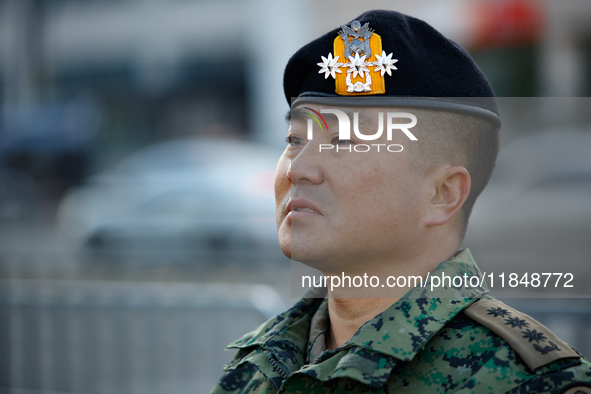 Colonel Kim Hyun-tae, Commander of the 707th Special Mission Group, holds a press conference in front of the Defense Convention Center in Yo...