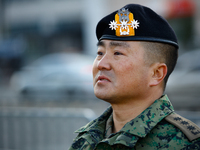 Colonel Kim Hyun-tae, Commander of the 707th Special Mission Group, holds a press conference in front of the Defense Convention Center in Yo...