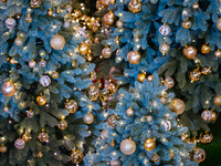 Visitors look at a Christmas tree installation at the Halo Shopping Park in Chongqing, China, on December 8, 2024. (