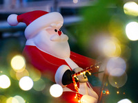 Visitors look at a Santa Claus installation at the Halo Shopping Park in Chongqing, China, on December 8, 2024. (