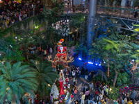 Visitors look at a Santa Claus installation at the Halo Shopping Park in Chongqing, China, on December 8, 2024. (