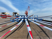 A large number of wind power generation equipment is ready to be shipped for export at the terminal of Oriental Port Branch of Lianyungang P...