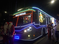 People admire the Ibirapuera Christmas tree in Sao Paulo, Brazil, on December 8, 2024. The tree's steel structure measures 18.5 meters in di...