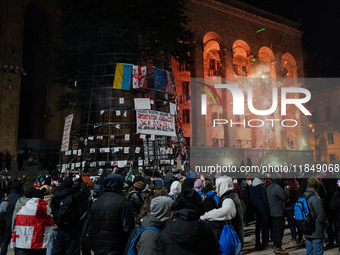 Anti-government protesters rally outside the parliament for an eleventh consecutive day of mass demonstrations against the government's post...