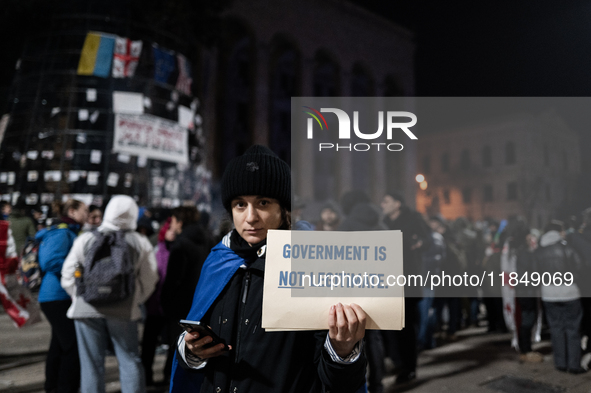 Anti-government protesters rally outside the parliament for an eleventh consecutive day of mass demonstrations against the government's post...