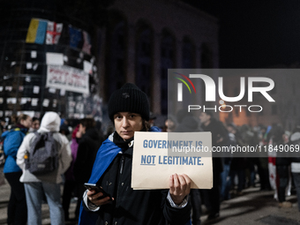 Anti-government protesters rally outside the parliament for an eleventh consecutive day of mass demonstrations against the government's post...