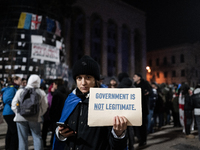 Anti-government protesters rally outside the parliament for an eleventh consecutive day of mass demonstrations against the government's post...