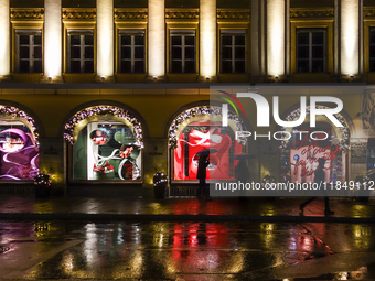 On a rainy evening in Munich, Bavaria, Germany, on December 8, 2024, during the Christmas season, the streets come alive with the glow of fe...