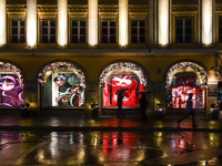 On a rainy evening in Munich, Bavaria, Germany, on December 8, 2024, during the Christmas season, the streets come alive with the glow of fe...