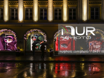 On a rainy evening in Munich, Bavaria, Germany, on December 8, 2024, during the Christmas season, the streets come alive with the glow of fe...