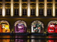 On a rainy evening in Munich, Bavaria, Germany, on December 8, 2024, during the Christmas season, the streets come alive with the glow of fe...