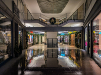 On a rainy evening in Munich, Bavaria, Germany, on December 8, 2024, during the Christmas season, the streets come alive with the glow of fe...