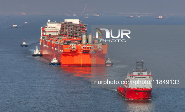 The NGUYA FLNG ship, China's first large floating natural gas liquefaction plant, sails on the Taicang section of the Yangtze River in Suzho...