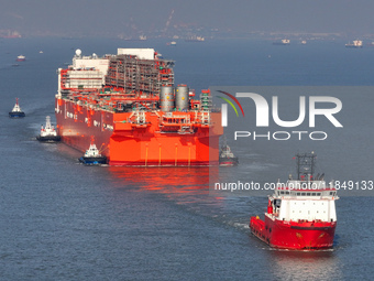 The NGUYA FLNG ship, China's first large floating natural gas liquefaction plant, sails on the Taicang section of the Yangtze River in Suzho...