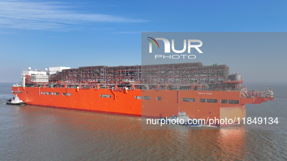 The NGUYA FLNG ship, China's first large floating natural gas liquefaction plant, sails on the Taicang section of the Yangtze River in Suzho...