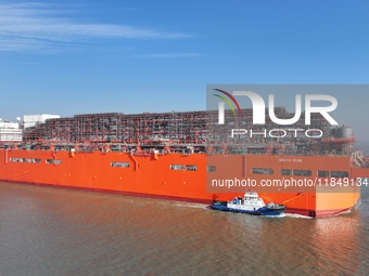 The NGUYA FLNG ship, China's first large floating natural gas liquefaction plant, sails on the Taicang section of the Yangtze River in Suzho...