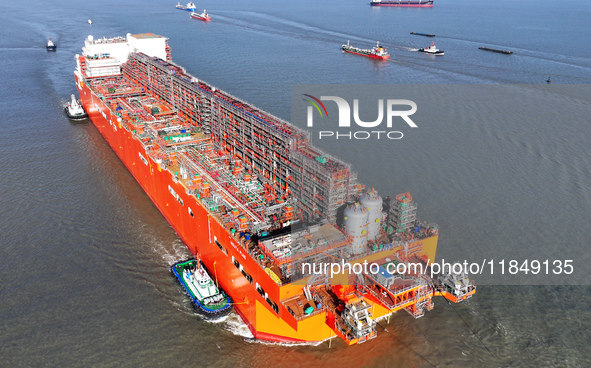 The NGUYA FLNG ship, China's first large floating natural gas liquefaction plant, sails on the Taicang section of the Yangtze River in Suzho...