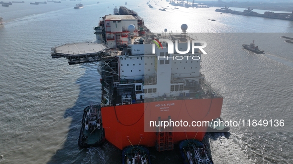 The NGUYA FLNG ship, China's first large floating natural gas liquefaction plant, sails on the Taicang section of the Yangtze River in Suzho...